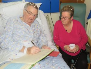 David and Lorraine signing wedding register